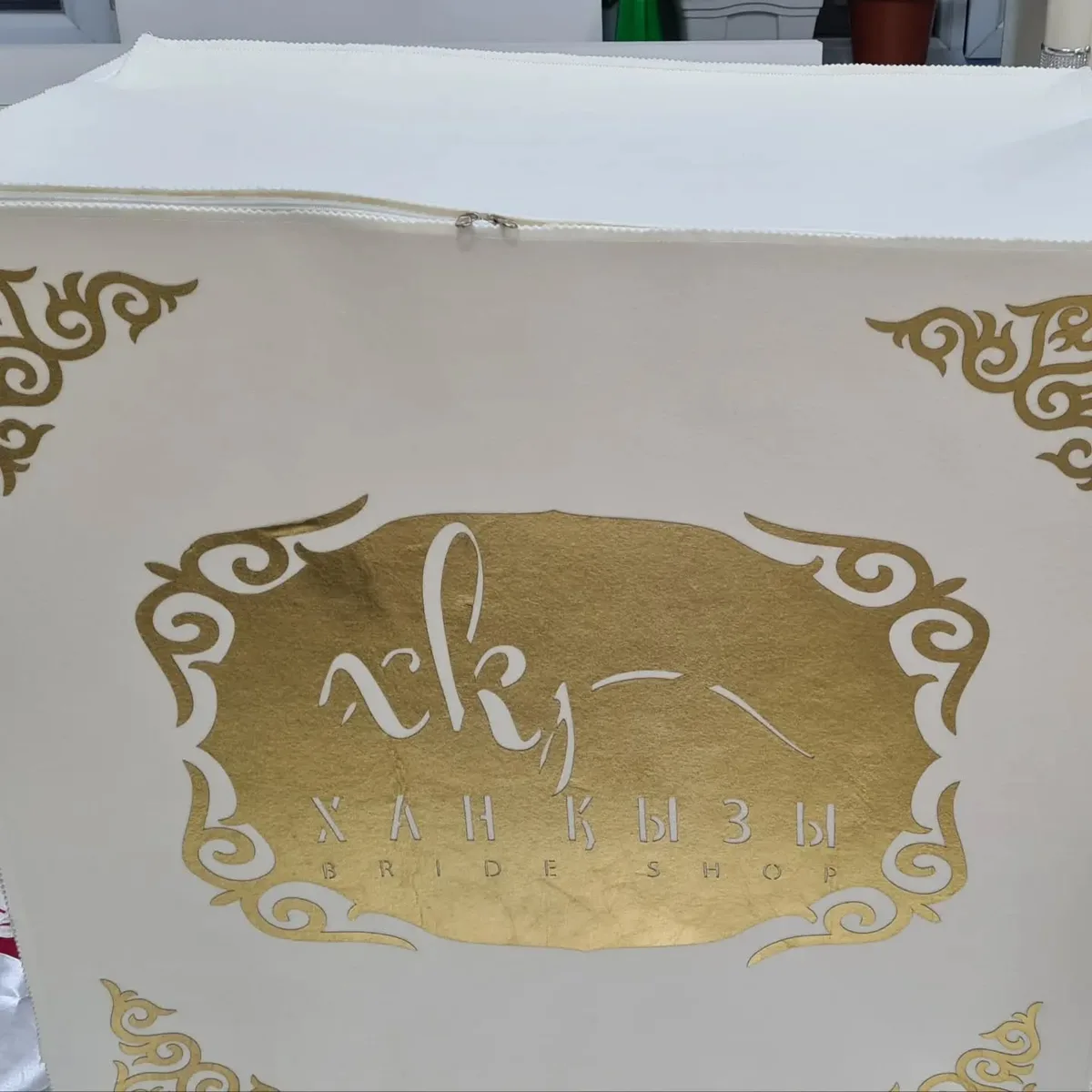Gold Xan Kyzy logo signage